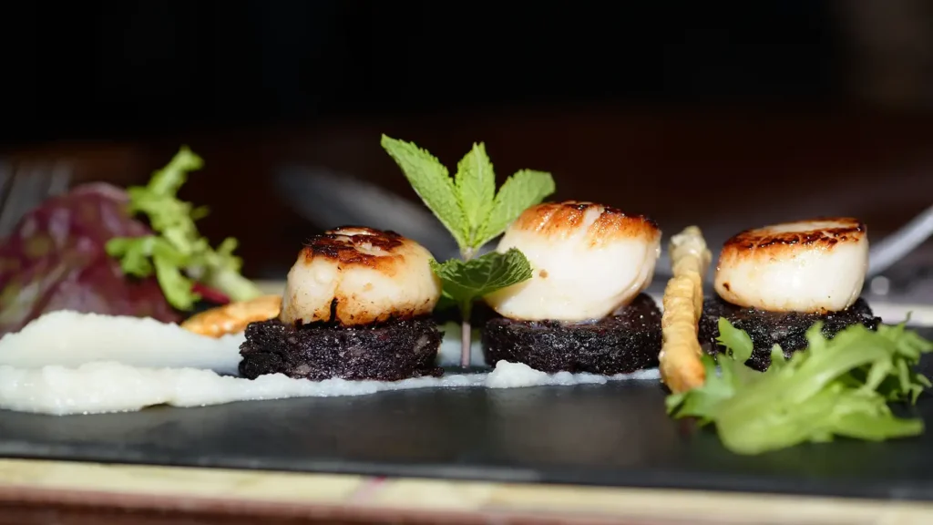 A traditional Full English breakfast served with eggs, bacon, and toast at a London café.
